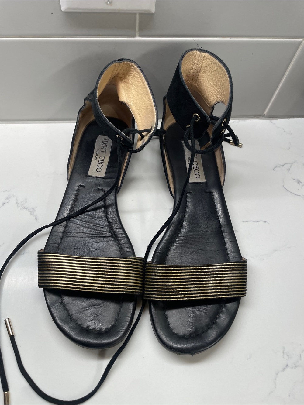 Jimmy Choo Black and Gold Lace-Up Flat Sandals